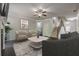 Comfortable living room with cozy seating arrangement, fireplace and open staircase at 207 Cherokee Reserve Cir, Canton, GA 30115