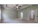 Open primary bedroom layout showcasing tray ceiling and en suite bath access at 207 Cherokee Reserve Cir, Canton, GA 30115