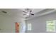Bright primary bedroom with modern ceiling fan and view of the trees through the windows at 207 Cherokee Reserve Cir, Canton, GA 30115