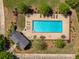 Aerial view of community pool surrounded by lounge chairs and lush landscaping at 207 Cherokee Reserve Cir, Canton, GA 30115