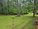 Expansive backyard with lush green grass and mature trees, offering a serene and private outdoor space at 2555 Angus Sw Ct, Marietta, GA 30008