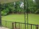 View from the porch overlooking a lush, green backyard with mature trees creating a private oasis at 2555 Angus Sw Ct, Marietta, GA 30008