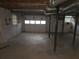 Unfinished basement with exposed ducts and support beams at 2555 Angus Sw Ct, Marietta, GA 30008