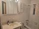 Neutral bathroom featuring a sink, toilet, tub, and shower at 2555 Angus Sw Ct, Marietta, GA 30008