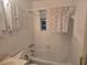 Neutral bathroom featuring a sink, toilet, tub, and shower at 2555 Angus Sw Ct, Marietta, GA 30008