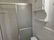 Bathroom featuring tiled walls and a glass-enclosed shower stall at 2555 Angus Sw Ct, Marietta, GA 30008