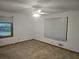 Carpeted bedroom with two windows, a ceiling fan and baseboard trim at 2555 Angus Sw Ct, Marietta, GA 30008