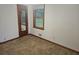 This bedroom has a window and a mirror door to a closet at 2555 Angus Sw Ct, Marietta, GA 30008