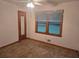 Simple bedroom with carpeted floors, a window, and a mirrored door at 2555 Angus Sw Ct, Marietta, GA 30008