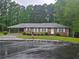 Charming one-story brick home with a covered carport and a well-manicured front lawn at 2555 Angus Sw Ct, Marietta, GA 30008