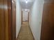 Straight hallway showcasing neutral walls and multiple wood-framed doors at 2555 Angus Sw Ct, Marietta, GA 30008