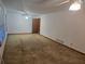 Open living room featuring neutral paint, carpet, ceiling fan, and a large window providing plenty of light at 2555 Angus Sw Ct, Marietta, GA 30008