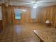Spacious living room featuring paneled walls, two windows and retro floors at 2555 Angus Sw Ct, Marietta, GA 30008