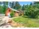 Charming home with beautiful wood siding, a well-manicured lawn, and attached garage at 3955 Old Fairburn Sw Rd, Atlanta, GA 30331