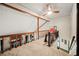 Upstairs hallway with wood beams and railings overlooking a living area with fireplace at 3955 Old Fairburn Sw Rd, Atlanta, GA 30331