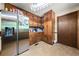 Spacious kitchen with stainless steel refrigerator, wood cabinets, and ample storage space at 3955 Old Fairburn Sw Rd, Atlanta, GA 30331