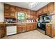 Well-equipped kitchen featuring stainless steel appliances, wood cabinets, and tile flooring at 3955 Old Fairburn Sw Rd, Atlanta, GA 30331