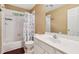Bathroom featuring a shower-tub combination, white vanity, and neutral wall color at 4560 Weathervane Dr, Alpharetta, GA 30022