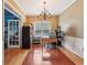 Bright home office with hardwood floors, wainscoting, and large window for ample natural light at 4560 Weathervane Dr, Alpharetta, GA 30022
