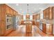 Gourmet kitchen with custom cabinets, stainless steel appliances, and center island at 1168 Woodtrace Ln, Auburn, GA 30011
