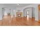 Open floor plan with multiple fireplaces and hardwood flooring at 1168 Woodtrace Ln, Auburn, GA 30011