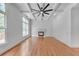 Spacious living room showcasing a fireplace, hardwood floors, and natural light at 1168 Woodtrace Ln, Auburn, GA 30011