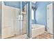 Bathroom with a shower and separate bathtub with a large soaking tub at 1719 Kings Cross Ct, Hoschton, GA 30548