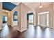 Elegant entryway featuring hardwood floors and arched doorways at 1719 Kings Cross Ct, Hoschton, GA 30548