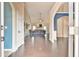 Inviting entryway with hardwood floors and open view to the living room at 1719 Kings Cross Ct, Hoschton, GA 30548