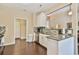 Bright kitchen featuring granite countertops, stainless steel appliances and mosaic backsplash at 1719 Kings Cross Ct, Hoschton, GA 30548