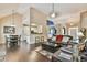 Spacious living room with hardwood floors, fireplace and access to kitchen at 1719 Kings Cross Ct, Hoschton, GA 30548