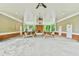 Open-air pavilion with picnic tables, ceiling fans, and a brick fireplace at 1719 Kings Cross Ct, Hoschton, GA 30548