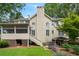 Back of the home featuring a screened in back porch and outdoor living space at 400 Fieldstone Lndg, Alpharetta, GA 30005