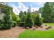 Secluded backyard with mature trees, lush landscaping and natural pine straw ground cover at 400 Fieldstone Lndg, Alpharetta, GA 30005