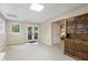 Spacious basement area with double doors to exterior, neutral walls, and wood cabinet at 400 Fieldstone Lndg, Alpharetta, GA 30005