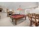 Finished basement featuring pool table, bar, and comfortable seating area at 400 Fieldstone Lndg, Alpharetta, GA 30005