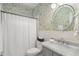 Charming bathroom with floral wallpaper, marble countertop, and shower with white curtain at 400 Fieldstone Lndg, Alpharetta, GA 30005