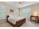 Comfortable bedroom with carpet, a cozy bed, lots of natural light, and a desk at 400 Fieldstone Lndg, Alpharetta, GA 30005