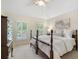 Light, bright bedroom with neutral colors, tray ceiling, and windows with plantation shutters at 400 Fieldstone Lndg, Alpharetta, GA 30005