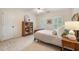 Comfortable bedroom featuring large windows with natural light and a decorative bookcase at 400 Fieldstone Lndg, Alpharetta, GA 30005