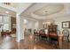 Spacious dining room with hardwood floors, modern chandelier, and fireplace feature at 400 Fieldstone Lndg, Alpharetta, GA 30005