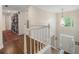 Bright two-story foyer with hardwood floors, a large window, and views of the front entrance at 400 Fieldstone Lndg, Alpharetta, GA 30005