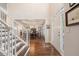 Inviting foyer with hardwood floors, staircase, and views into the dining room at 400 Fieldstone Lndg, Alpharetta, GA 30005