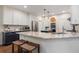 Spacious kitchen featuring a large granite island, stainless steel appliances, and pendant lighting at 400 Fieldstone Lndg, Alpharetta, GA 30005