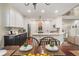 Bright kitchen with granite countertops, island, stainless appliances, and adjacent dining area at 400 Fieldstone Lndg, Alpharetta, GA 30005