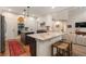 Open-concept kitchen featuring a granite island, stainless appliances, and seating at the breakfast bar at 400 Fieldstone Lndg, Alpharetta, GA 30005