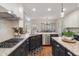 Modern kitchen featuring granite countertops, a stainless steel dishwasher, and a gas cooktop at 400 Fieldstone Lndg, Alpharetta, GA 30005
