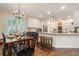 Eat-in kitchen area with island seating, stainless appliances, and hardwood flooring at 400 Fieldstone Lndg, Alpharetta, GA 30005