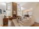 Spacious living room with stone fireplace, high ceilings, and a comfortable seating area at 400 Fieldstone Lndg, Alpharetta, GA 30005