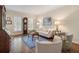 Bright living room with hardwood floors, shutters, neutral furniture, and stylish decor at 400 Fieldstone Lndg, Alpharetta, GA 30005